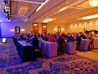 Conference attendees seated in ballroom